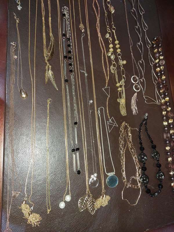 A  VINTAGE COLLECTION OF GOLD PLATED AND SILVER PLATED NECKLACES