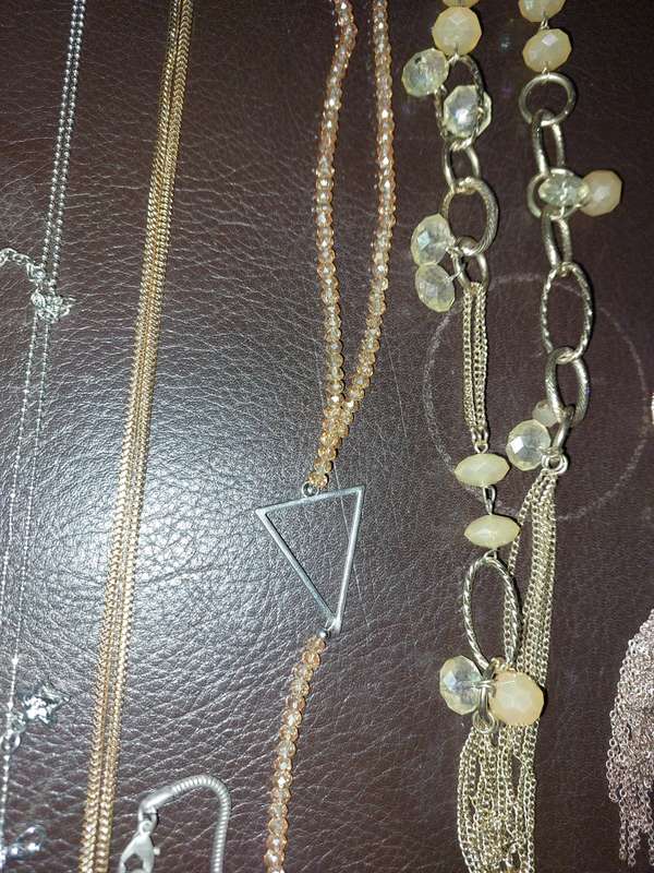 A  VINTAGE COLLECTION OF GOLD PLATED AND SILVER PLATED NECKLACES
