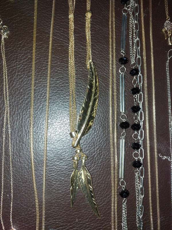 A  VINTAGE COLLECTION OF GOLD PLATED AND SILVER PLATED NECKLACES