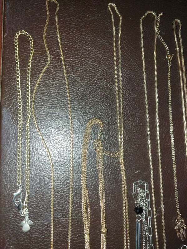 A  VINTAGE COLLECTION OF GOLD PLATED AND SILVER PLATED NECKLACES