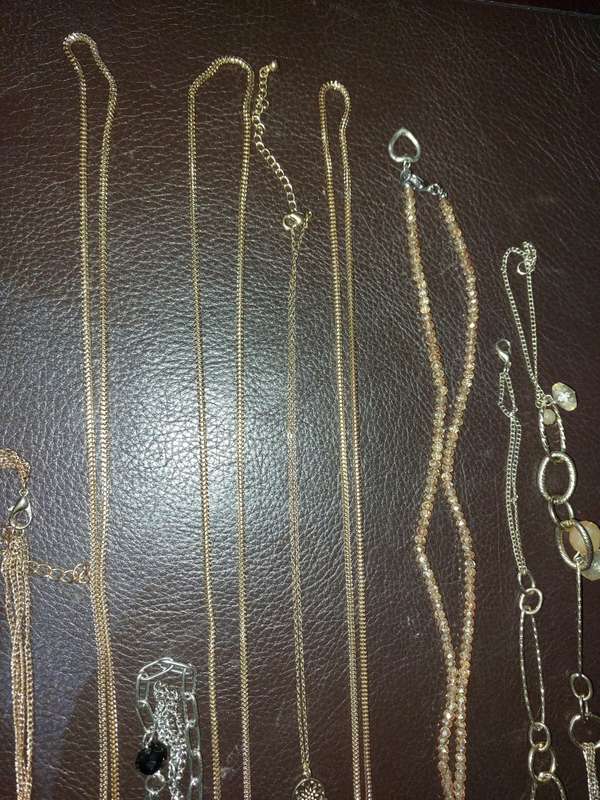 A  VINTAGE COLLECTION OF GOLD PLATED AND SILVER PLATED NECKLACES