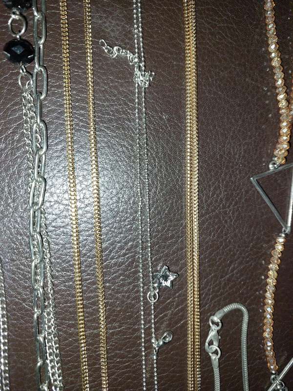 A  VINTAGE COLLECTION OF GOLD PLATED AND SILVER PLATED NECKLACES