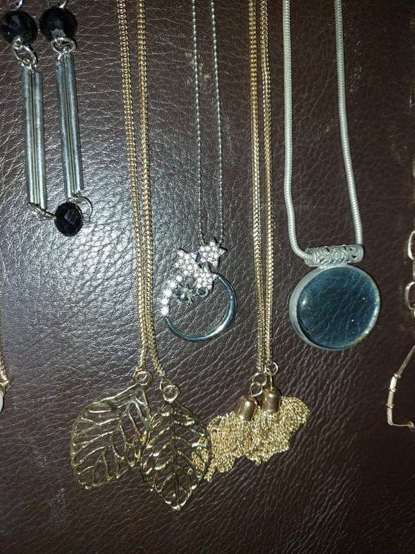 A  VINTAGE COLLECTION OF GOLD PLATED AND SILVER PLATED NECKLACES
