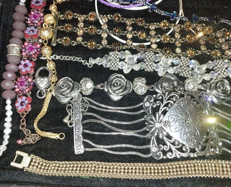 A BULK VINTAGE COLLECTION OF BRACELETS AND BANGLES SOLD AS IS