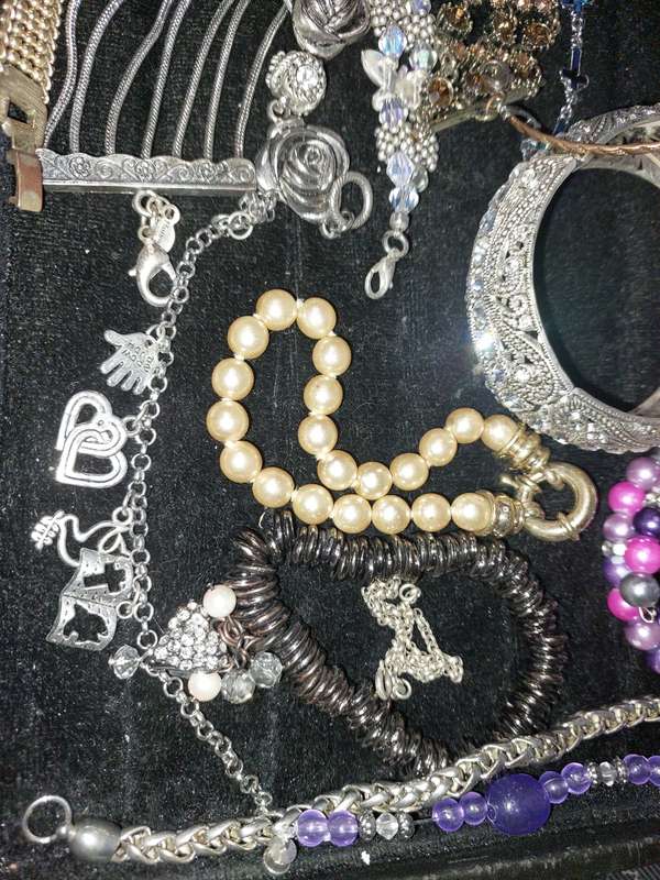 A BULK VINTAGE COLLECTION OF BRACELETS AND BANGLES SOLD AS IS