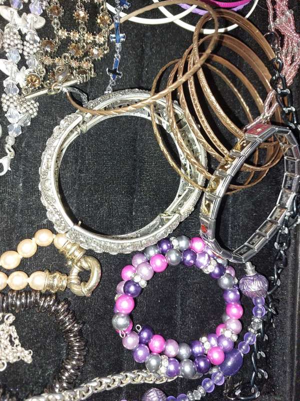 A BULK VINTAGE COLLECTION OF BRACELETS AND BANGLES SOLD AS IS