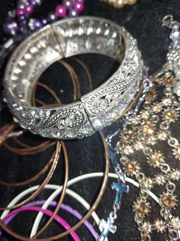 A BULK VINTAGE COLLECTION OF BRACELETS AND BANGLES SOLD AS IS