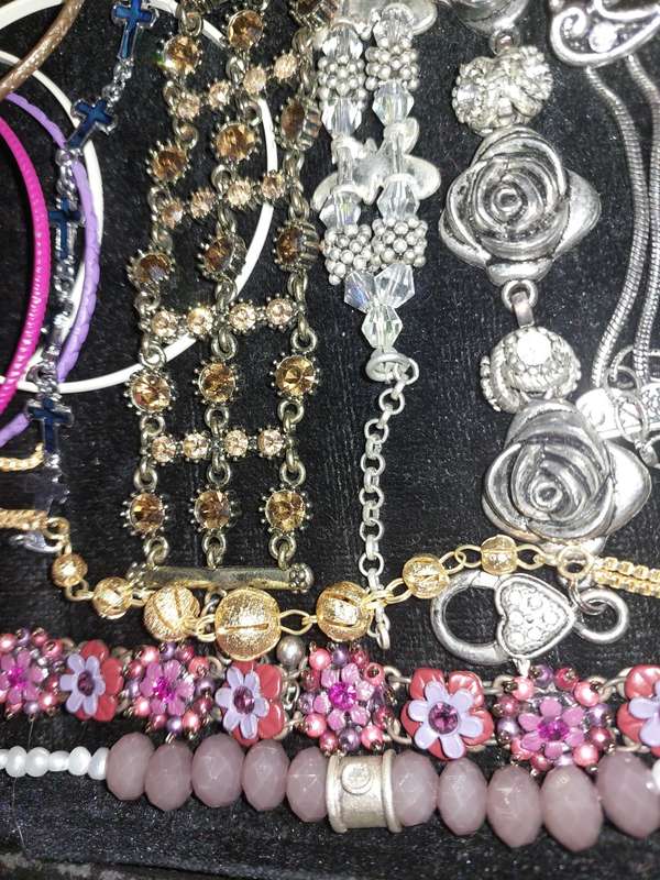 A BULK VINTAGE COLLECTION OF BRACELETS AND BANGLES SOLD AS IS