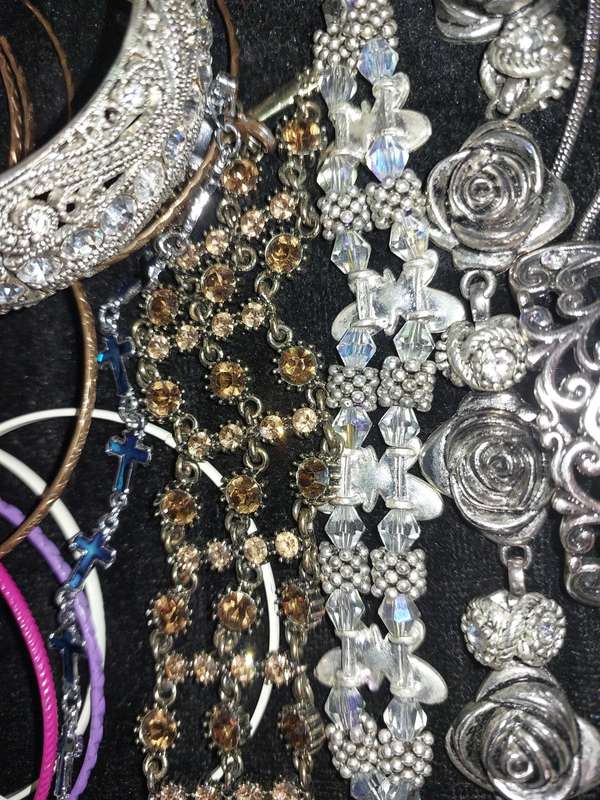 A BULK VINTAGE COLLECTION OF BRACELETS AND BANGLES SOLD AS IS