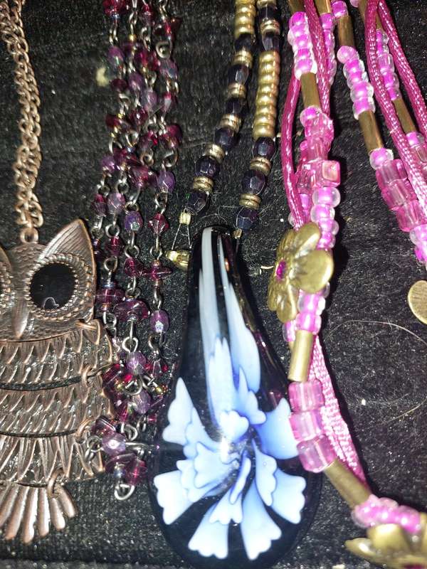 A BULK COLLECTION OF COSTUME JEWELRY AND THE PLASTIC CASES SOLD AS IS
