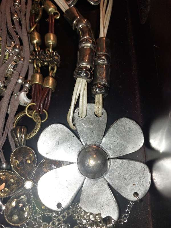 A BULK COLLECTION OF COSTUME JEWELRY AND THE PLASTIC CASES SOLD AS IS