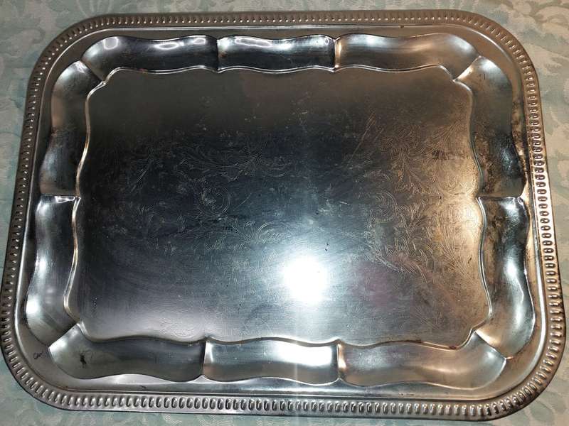 A VINTAGE SILVER PLATED RECTANGULAR SERVING TRAY SOLD AS IS