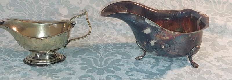 TWO ANTIQUE SAUCE JUGS ONE NEEDS A HANDLE REPLACED SOLD AS IS