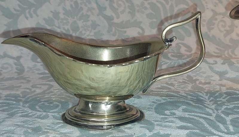 TWO ANTIQUE SAUCE JUGS ONE NEEDS A HANDLE REPLACED SOLD AS IS