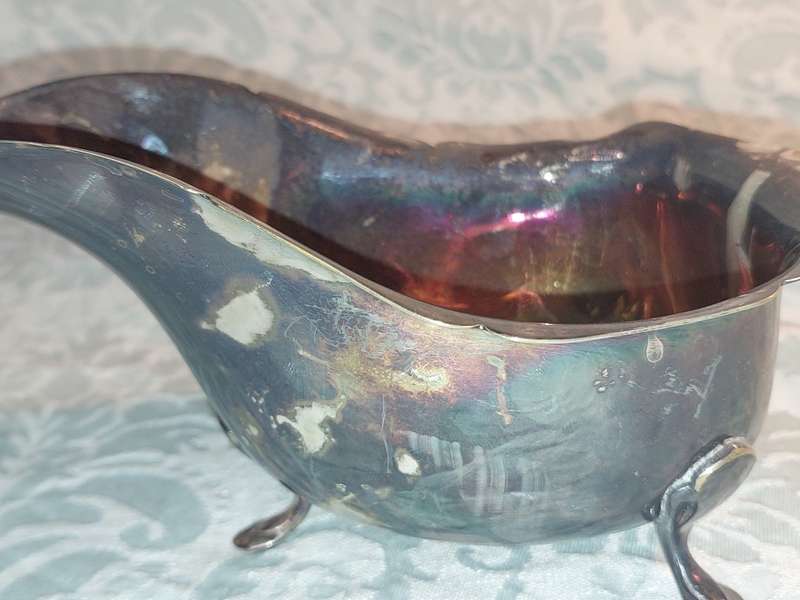 TWO ANTIQUE SAUCE JUGS ONE NEEDS A HANDLE REPLACED SOLD AS IS