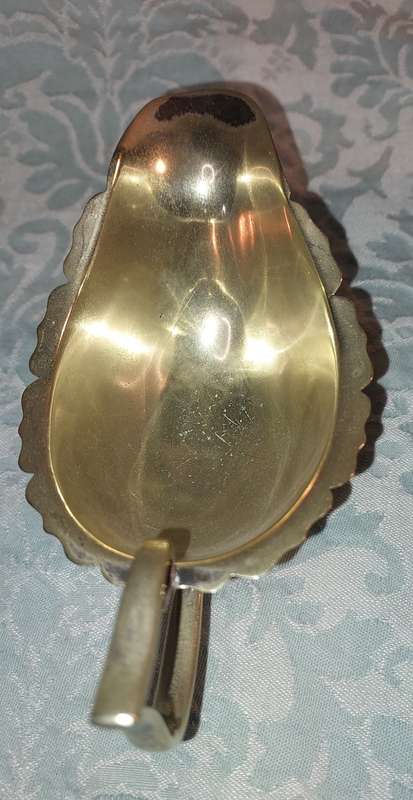 TWO ANTIQUE SAUCE JUGS ONE NEEDS A HANDLE REPLACED SOLD AS IS