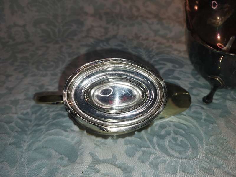 TWO ANTIQUE SAUCE JUGS ONE NEEDS A HANDLE REPLACED SOLD AS IS