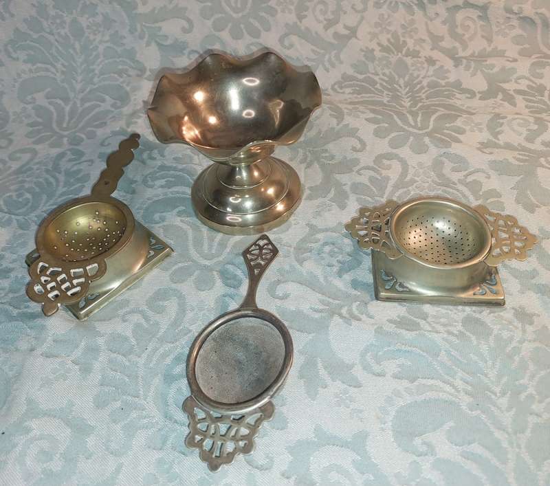 AN ANTIQUE COLLECTION OF VICTORIAN TEA STRAINERS SOLD AS IS