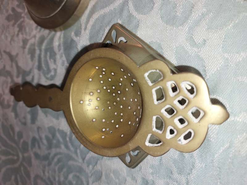 AN ANTIQUE COLLECTION OF VICTORIAN TEA STRAINERS SOLD AS IS