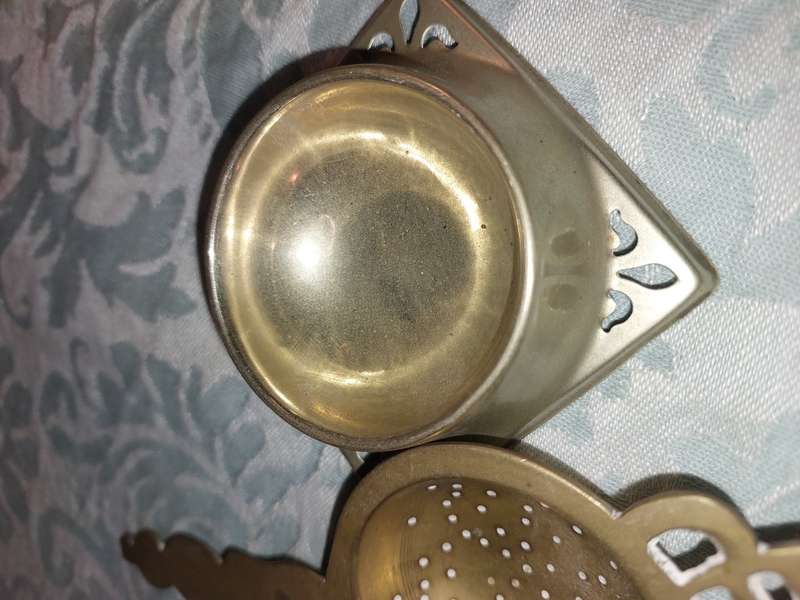 AN ANTIQUE COLLECTION OF VICTORIAN TEA STRAINERS SOLD AS IS