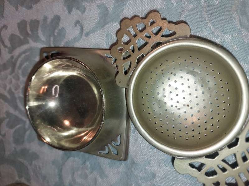 AN ANTIQUE COLLECTION OF VICTORIAN TEA STRAINERS SOLD AS IS