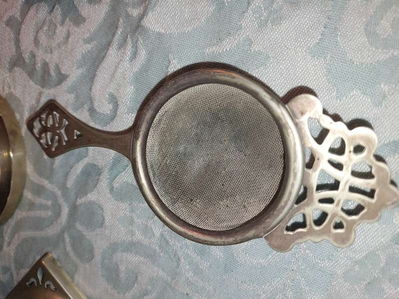 AN ANTIQUE COLLECTION OF VICTORIAN TEA STRAINERS SOLD AS IS