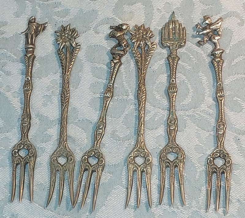 A COLLECTION OF ITALIAN PASTRY FORKS SOLD AS IS