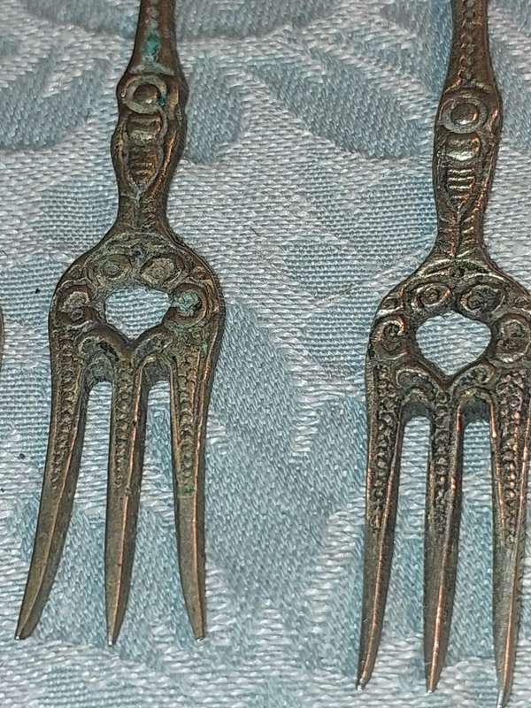 A COLLECTION OF ITALIAN PASTRY FORKS SOLD AS IS
