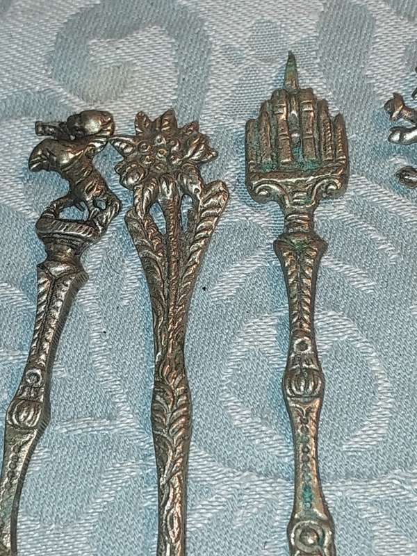 A COLLECTION OF ITALIAN PASTRY FORKS SOLD AS IS