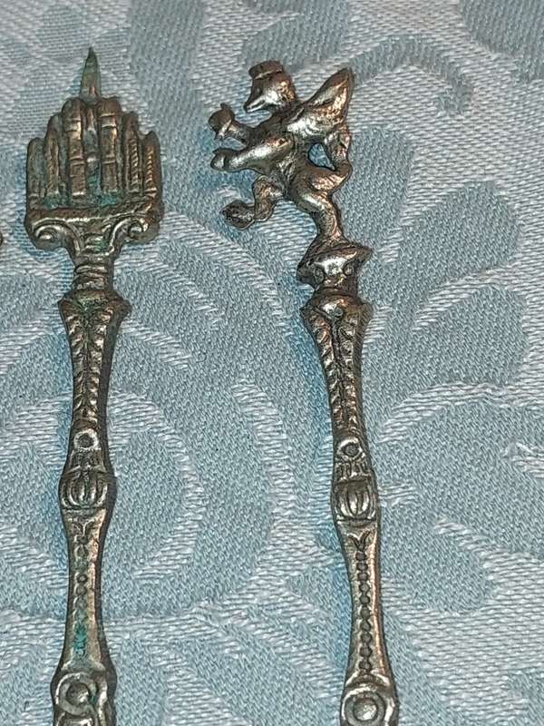 A COLLECTION OF ITALIAN PASTRY FORKS SOLD AS IS