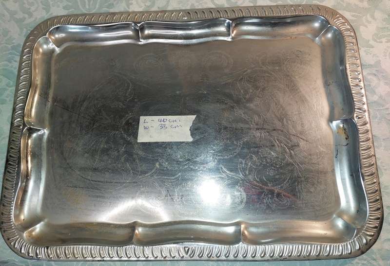 A VINTAGE SERVING TRAY NEEDS POLISHING SOLD AS IS
