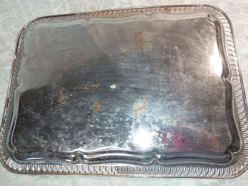 A VINTAGE SERVING TRAY NEEDS POLISHING SOLD AS IS