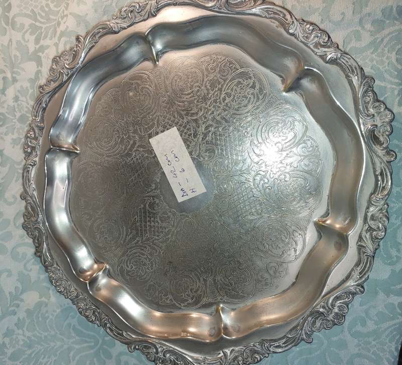 A ROUND VINTAGE VICTORIAN SERVING TRAY SILVER PLATED SOLD AS IS