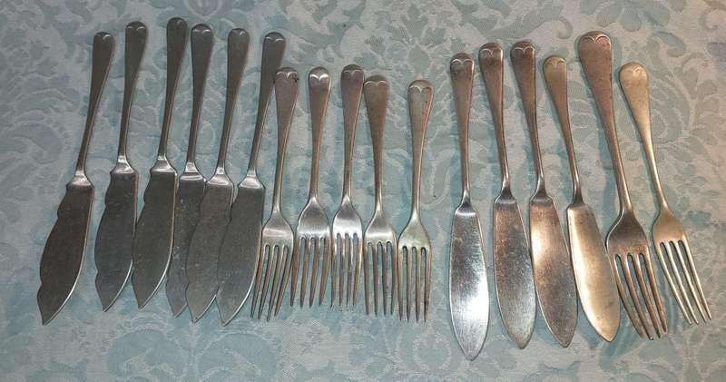 A VINTAGE COLLECTION FISH KNIVES AND FORKS SOLD AS IS