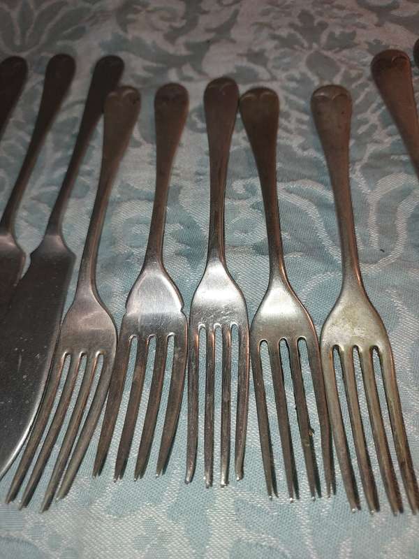 A VINTAGE COLLECTION FISH KNIVES AND FORKS SOLD AS IS