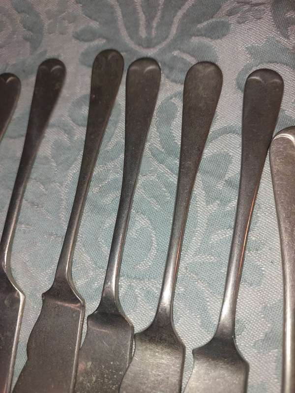 A VINTAGE COLLECTION FISH KNIVES AND FORKS SOLD AS IS