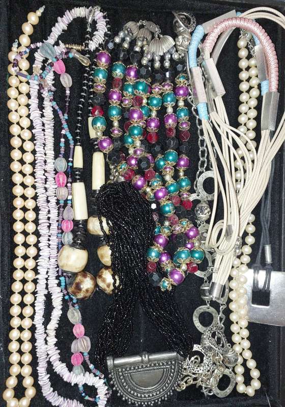 A VINTAGE COLLECTION OF COSTUME NECKLACES SOLD AS IS