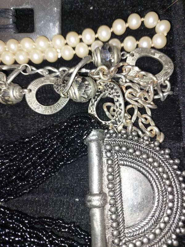 A VINTAGE COLLECTION OF COSTUME NECKLACES SOLD AS IS