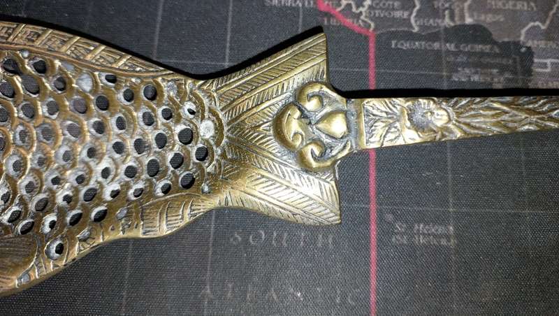 A VINTAGE BRASS ORNATE ART DECOR LADEL A FISH DESIGN