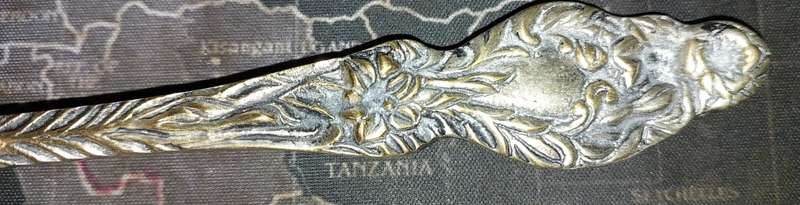 A VINTAGE BRASS ORNATE ART DECOR LADEL A FISH DESIGN