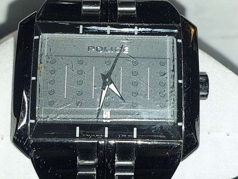 A MENS POLICE RECTANGULAR BLACK ENAMEL WRISTWATCH