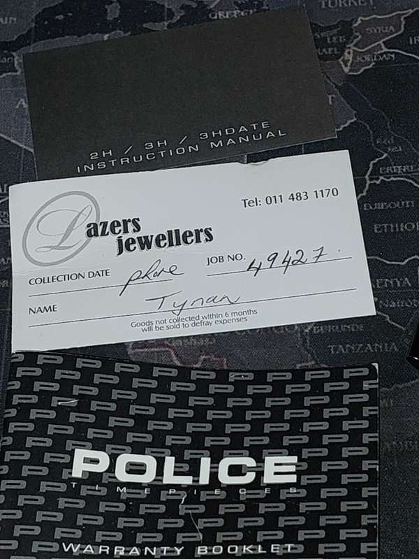 A MENS POLICE RECTANGULAR BLACK ENAMEL WRISTWATCH