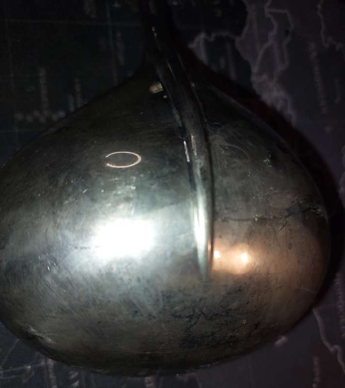 A SOLID SILVER PLATED SOUP LADLE APPROXIMATELY 33 CENTIMETERS IN LENGTH