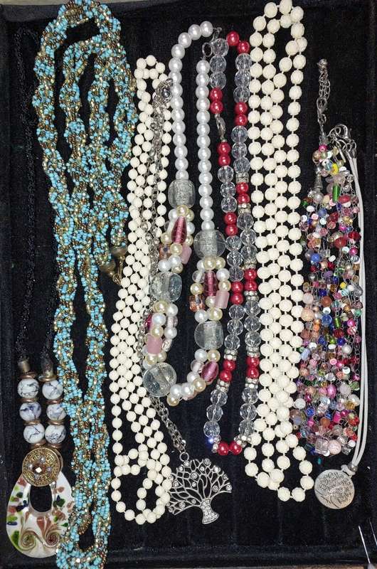 A COLLECTION OF COSTUME NECKLACES SOLD AS IS