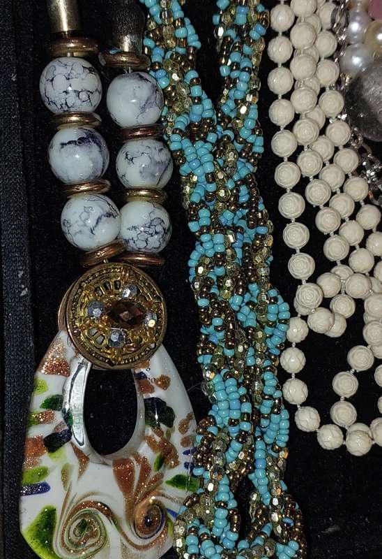 A COLLECTION OF COSTUME NECKLACES SOLD AS IS
