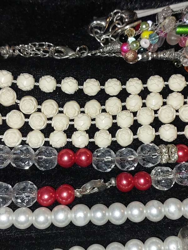 A COLLECTION OF COSTUME NECKLACES SOLD AS IS