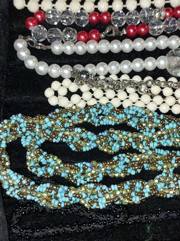 A COLLECTION OF COSTUME NECKLACES SOLD AS IS