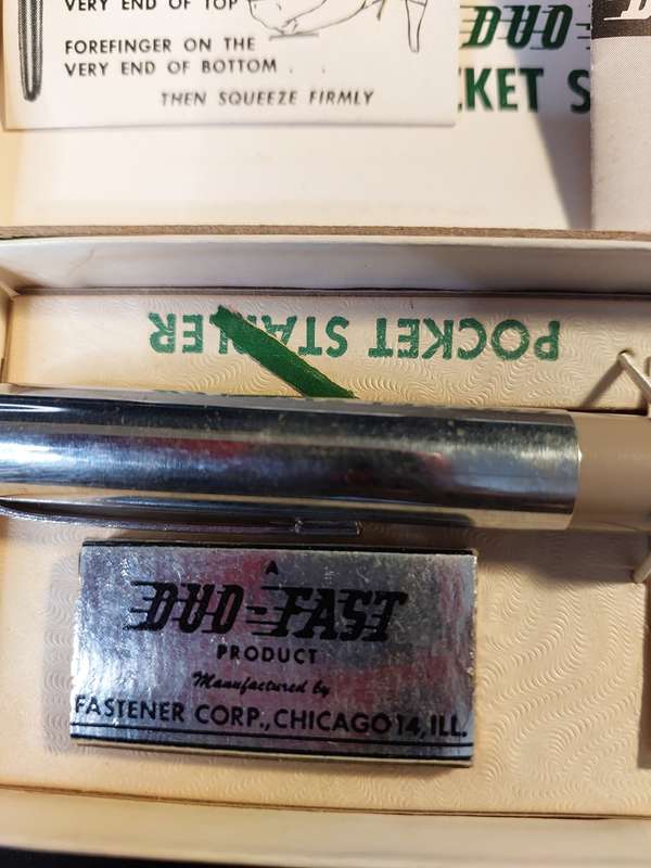 A VINTAGE POCKET STAPLER IN ITS ORIGINAL BOX