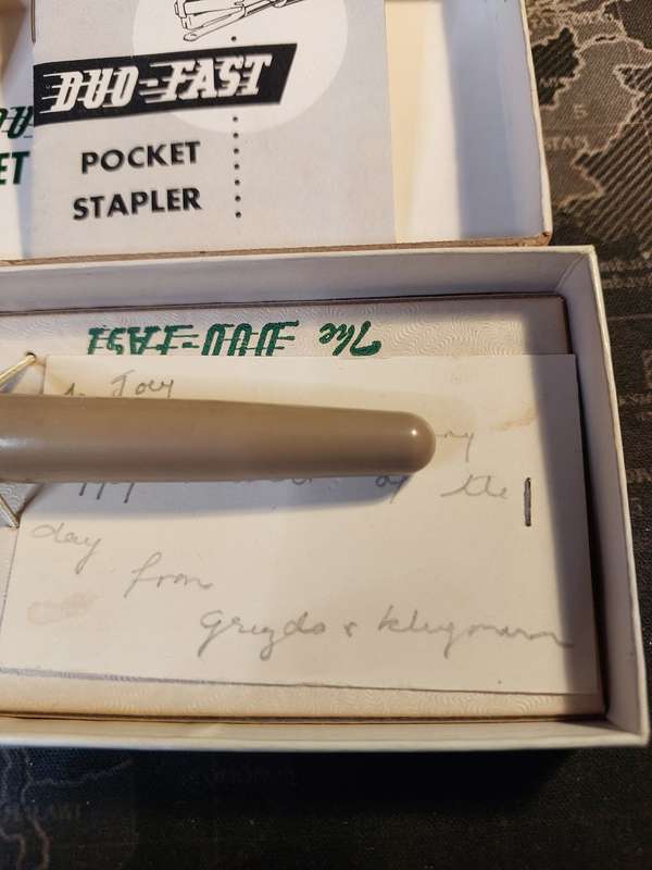 A VINTAGE POCKET STAPLER IN ITS ORIGINAL BOX