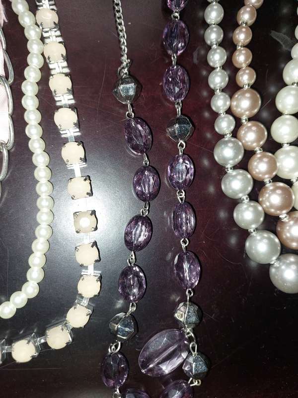 A COLLECTION OF HIGH QUALITY DESIGNER MULTI STRAND COSTUME NECKLACES SOLD AS IS